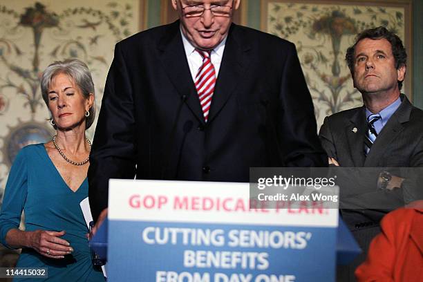 Sen. John Rockefeller speaks as Secretary of Health and Human Services Kathleen Sebelius and U.S. Sen. Sherrod Brown listen during a news conference...