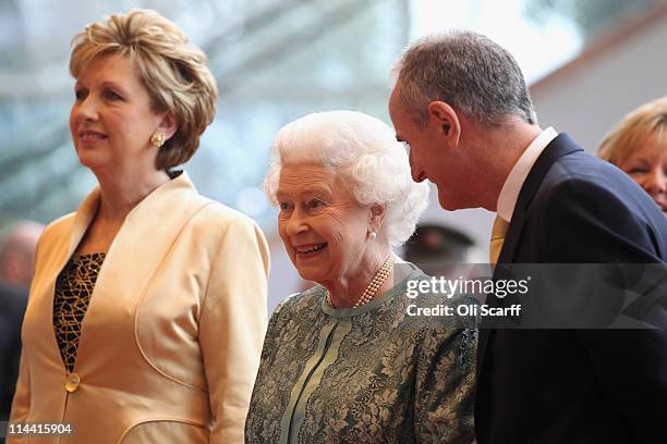 Queen Elizabeth II , Irish President Mary McAleese and her husband Martin McAleese listen to live classical music as they arrive at the Convention...