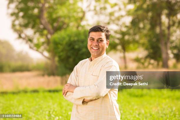 indian farmer at field - stock image - indian culture stock pictures, royalty-free photos & images