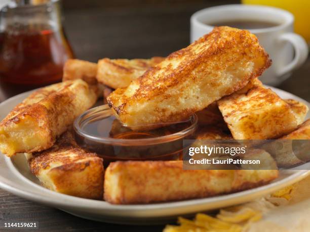 crispy french toast fingers with maple syrup - sticking stock pictures, royalty-free photos & images