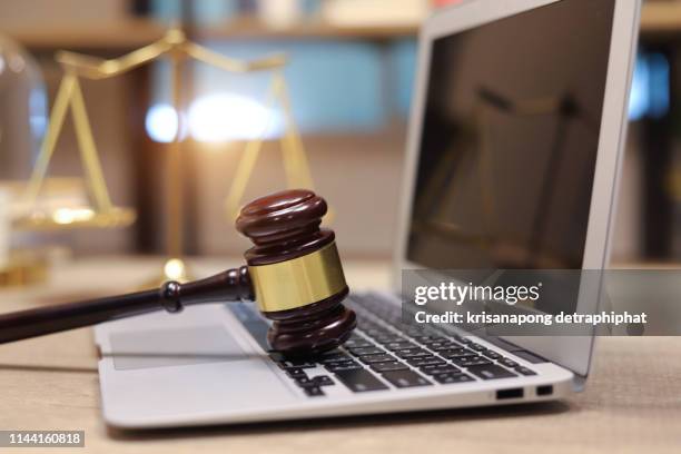 law legal technology concept. judge gavel and computer on desk of lawyer with legal icon - privacy policy stockfoto's en -beelden