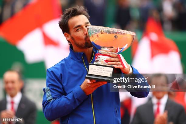 Fabio Fognini of Italy kisses the winners trophy after his straight sets victory against Dusan Lajovic of Serbia in the men's singles final during...