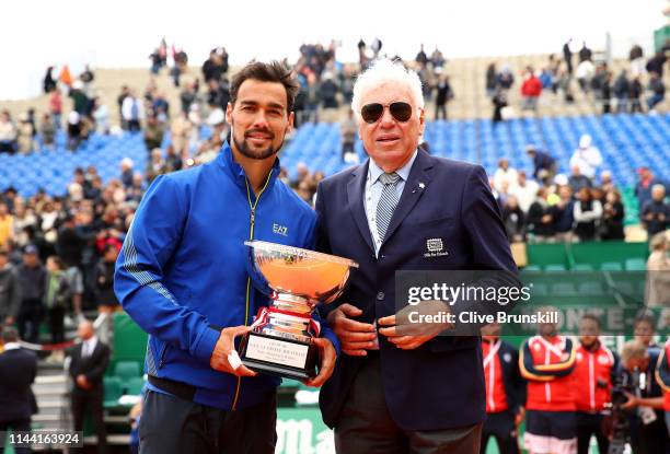 Fabio Fognini of Italy holds his winners trophy with the last Italian winner of the tournament in 1968 Nicola Pietrangeli, after his straight sets...