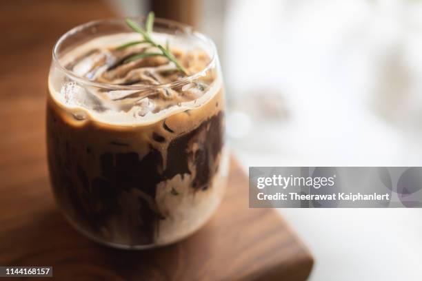 a glass of ice chocolate on the table (isolated background) - chocolate smoothie stock pictures, royalty-free photos & images