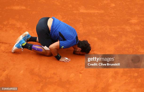 Fabio Fognini of Italy kisses the court after his straight sets victory against Dusan Lajovic of Serbia in the men's singles final during day eight...