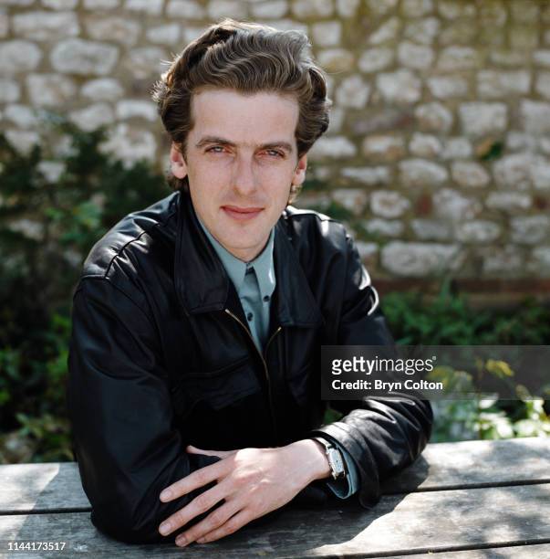 Peter Capaldi, a Scottish actor takes a break from filming in the village of Thornham, North Norfolk, U.K., Circa 1990.