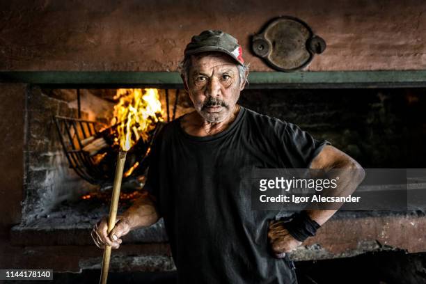 argentine barbecue man - argentina people stock pictures, royalty-free photos & images