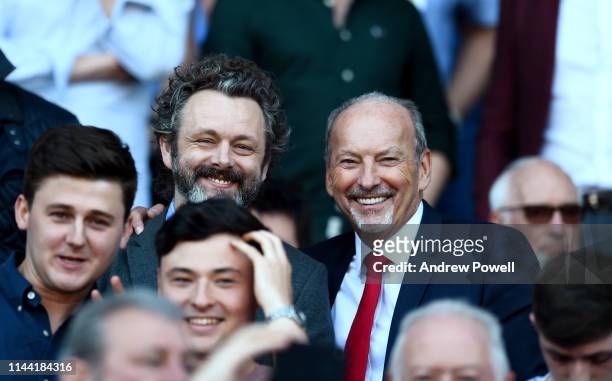 Peter Moore CEO of Liverpool with Michael Sheen actor during the Premier League match between Cardiff City and Liverpool FC at Cardiff City Stadium...