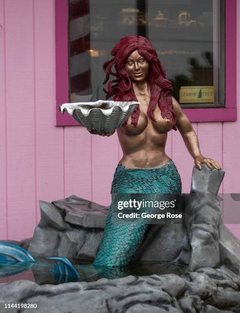 Redheaded mermaid greets visitors to this coastal community on April 7 in Lincoln City, Oregon. Oregon's diverse Wine Country and agricultural...