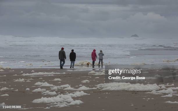 Heavy surf whips up a flurry of beach sea foam at this coastal community on April 7 in Lincoln City, Oregon. Oregon's diverse Wine Country and...