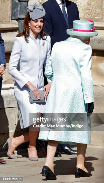 Catherine, Duchess of Cambridge curtsies to Queen Elizabeth II as they attend the traditional Easter Sunday church service at St George's Chapel,...