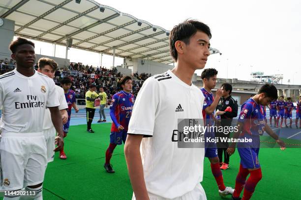 Takuhiro Nakai of Real Madrid walks into the pitch prior to the U16 Kirin Lemon Cup final between Real Madrid and FC Tokyo at Yanagishima Sports Park...