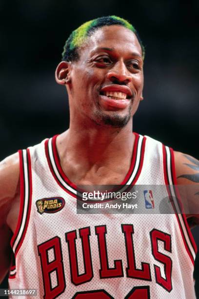 Dennis Rodman of the Chicago Bulls looks on against the Utah Jazz during Game Five of the 1998 NBA Finals on June 12, 1998 at the United Center in...