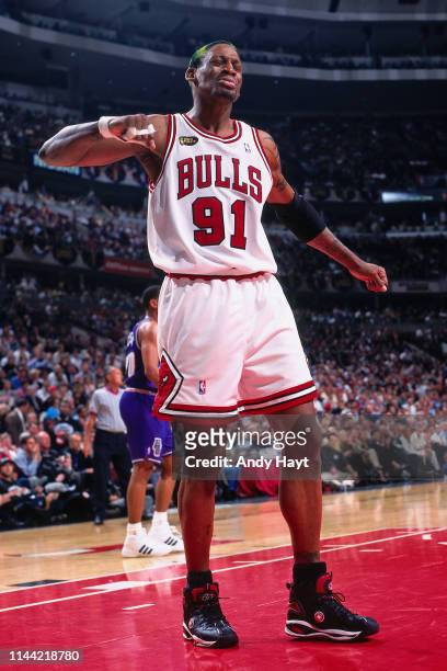 Dennis Rodman of the Chicago Bulls reacts to a play against the Utah Jazz during Game Four of the 1998 NBA Finals on June 10, 1998 at the United...