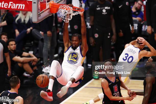 Kevin Durant of the Golden State Warriors dunks the ball against the Los Angeles Clippers during the fourth quarter of Game Four of Round One of the...