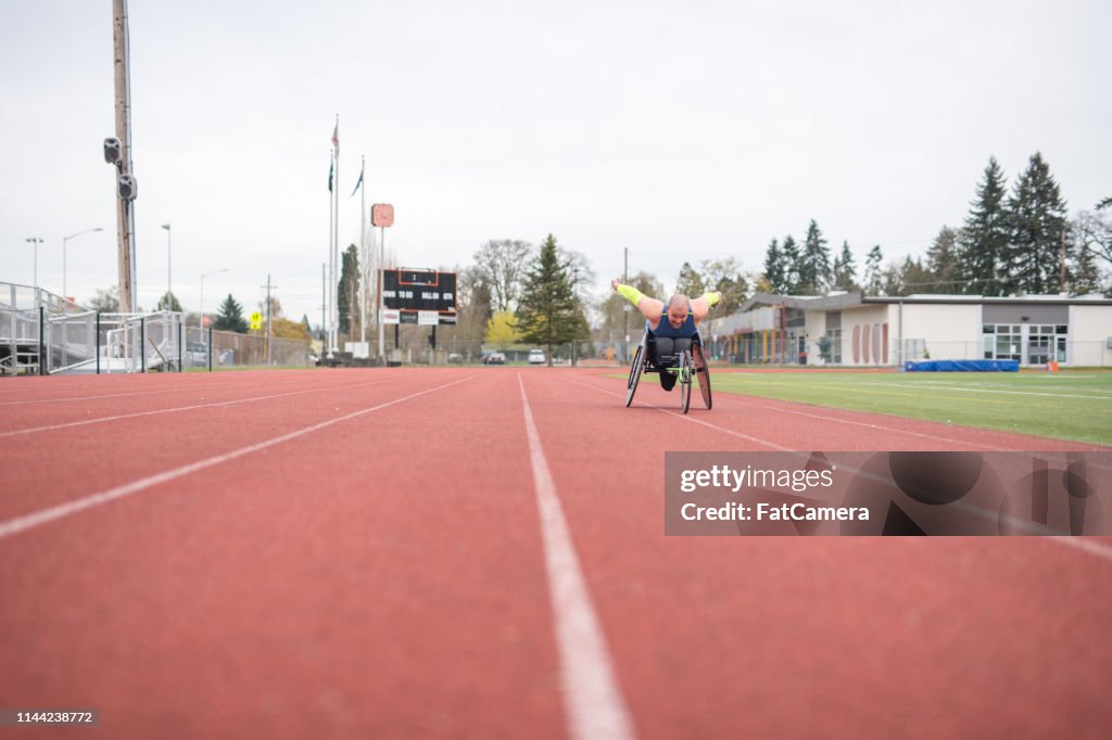 Disabled Track Racing Adaptive Athlete Training On His Racing Wheelchair On A Stadium Track ...