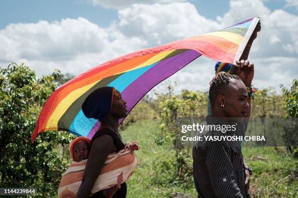 Refugees from South Sudan, Uganda and DR Congo walk on the way to their protest to demand their protection at the office of the United Nations High...