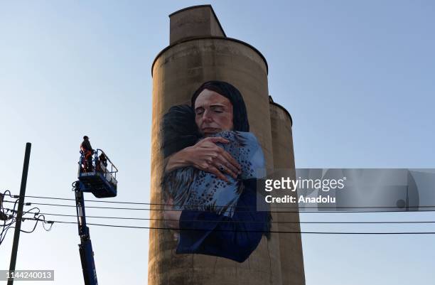 Mural painting depicts Prime Minister of New Zealand, Jacinda Ardern hugs a relative of Christchurch terror attack victim is seen on a silo in...
