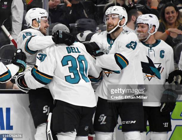 Tomas Hertl, Aaron Dell, Barclay Goodrow and Joe Pavelski of the San Jose Sharks celebrate after Hertl scored a game-winning short-handed goal...