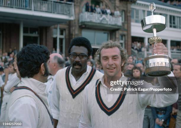 Lancashire captain David Lloyd lifts the Gillette Cup with teammates Farokh Engineer and Clive Lloyd after Lancashire beat Middlesex in the Gillette...