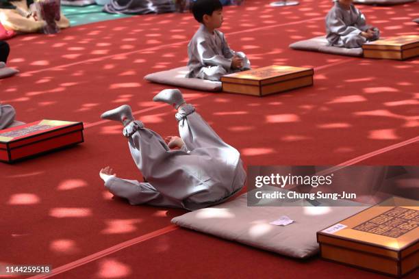 South Korean child monks pray during the 'Children Becoming Buddhist Monks' ceremony forthcoming buddha's birthday at a Jogye temple on April 22,...