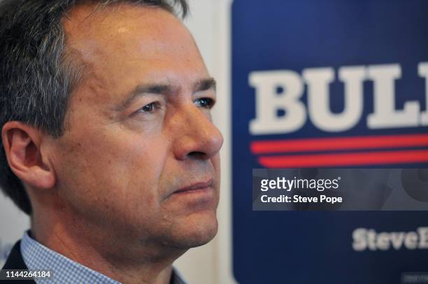 Democratic presidential candidate Montana Gov. Steve Bullock listens during a campaign stop at a coffee shop on May 17, 2019 in Newton, Iowa. Bullock...