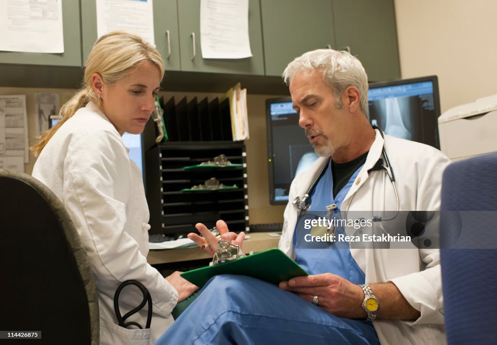 Two Doctors Conversation Two Doctors In Discussion High-Res Stock Photo - Getty Images