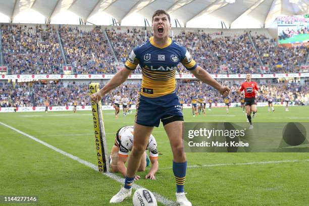 Mitchell Moses of the Eels celebrates scoring a try during the round 6 NRL match between the Parramatta Eels and Wests Tigers at Bankwest Stadium on...