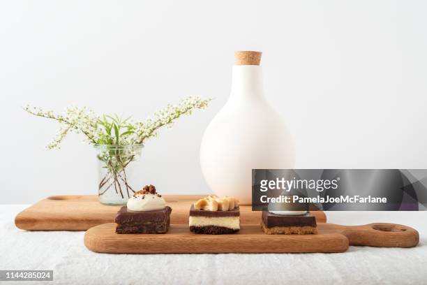 reclaimed wood serving trays with fudge, peanut butter, chocolate desserts - white fudge stock pictures, royalty-free photos & images