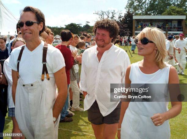 Richard E. Grant, a Swazi-British actor, left, with Rory McGrath, a British comedian, centre, with Samantha Janus, a British actress, singer and...