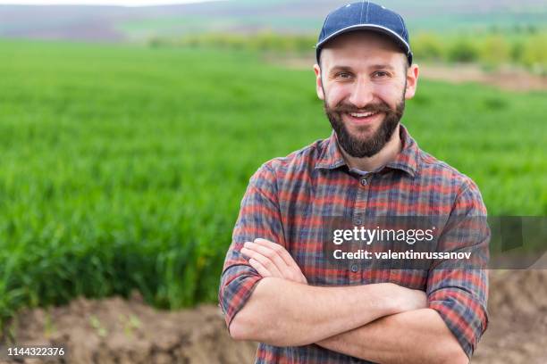 farmer standing with arms crossed - farmer arms crossed stock pictures, royalty-free photos & images