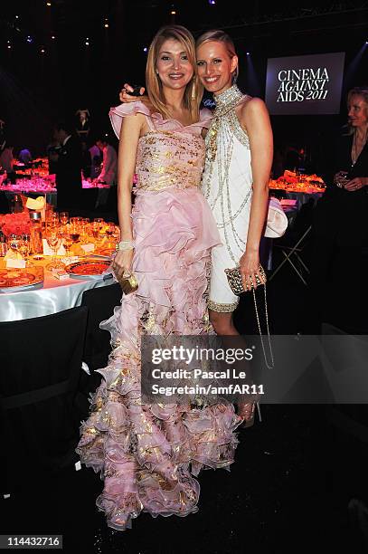 Gulnara Karimova and Karolina Kurkova attend amfAR's Cinema Against AIDS Gala during the 64th Annual Cannes Film Festival at Hotel Du Cap on May 19,...