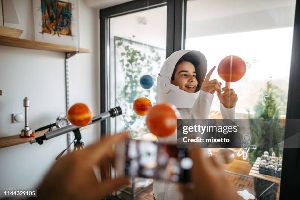 my first picture from mars - kids playing ball in house stock pictures, royalty-free photos & images