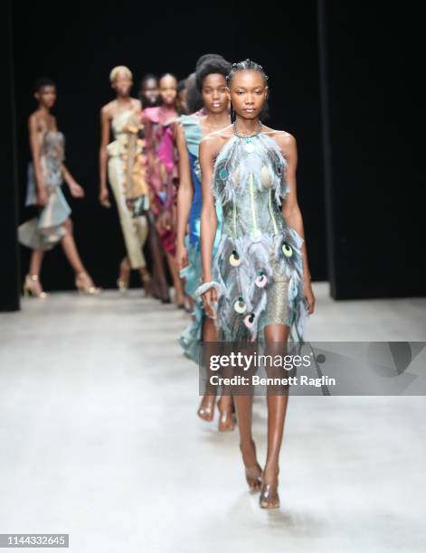 Models walk the runway wearing Deola Sagoe during Arise Fashion Week on April 21, 2019 in Lagos, Nigeria.