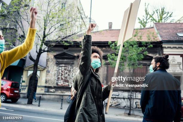 young protesters - angry protestor stock pictures, royalty-free photos & images