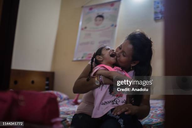 Samantha, 3 years old, and her mother, Jéssica, play at home in Neiva, Huila, Colombia on May 13, 2019. A generation of children with microcephaly...