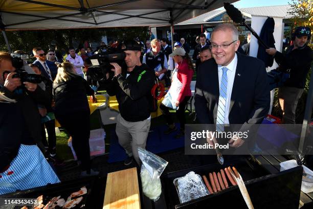 Australian Prime Minister Scott Morrison attends a sausage sizzle on Election Day at Norwood Primary School on May 18, 2019 in Launceston, Australia....