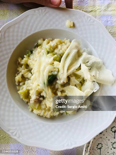risotto with asparagus, sausage and shaved grana cheese - shaved asparagus stock pictures, royalty-free photos & images
