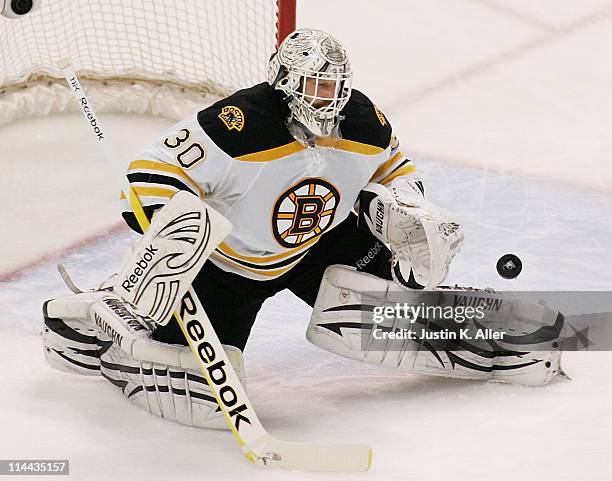 Tim Thomas of the Boston Bruins makes a save against the Tampa Bay Lightning in Game Three of the Eastern Conference Finals during the 2011 NHL...