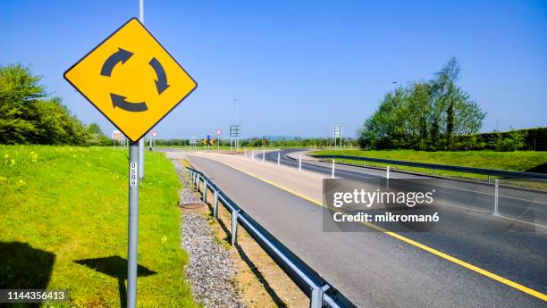 Roundabout With Signs 994 Roundabout Sign Stock Photos, High-Res Pictures, and Images - Getty ...