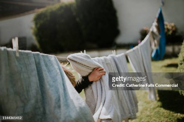 clothes line - draped sheet stock pictures, royalty-free photos & images
