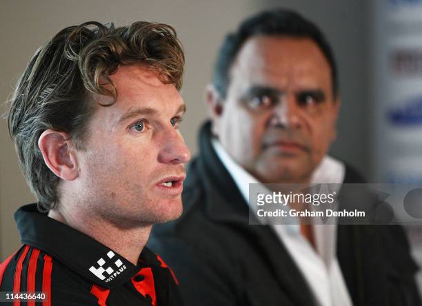 James Hird coach of the Bombers and former Essendon player Michael Long talk to the media during an Essendon Bombers press conference ahead of their...