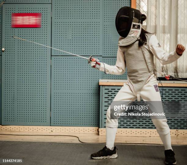 fencer with fencing mask - fencing sport stock pictures, royalty-free photos & images