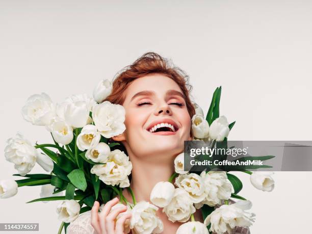 beautiful woman with flowers - bridal makeup stock pictures, royalty-free photos & images