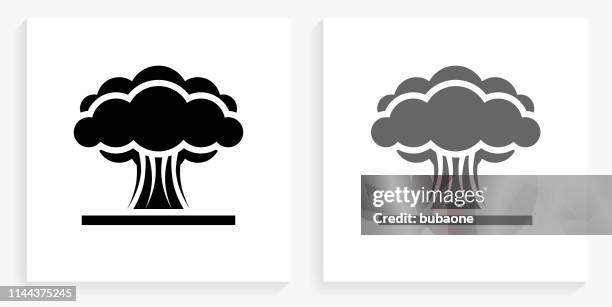 atomic explosion black and white square icon - nuclear bomb explosion stock illustrations