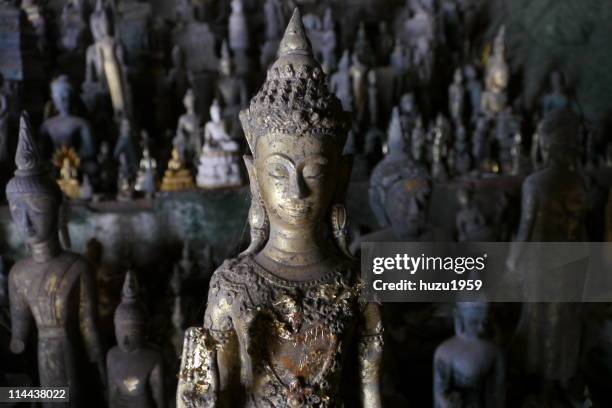 little buddha in the cave - pak ou caves stock pictures, royalty-free photos & images