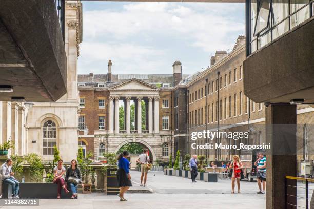 people walking in the king´s college situated on the south side of the strand in central london, england, uk. - king's college london stock pictures, royalty-free photos & images