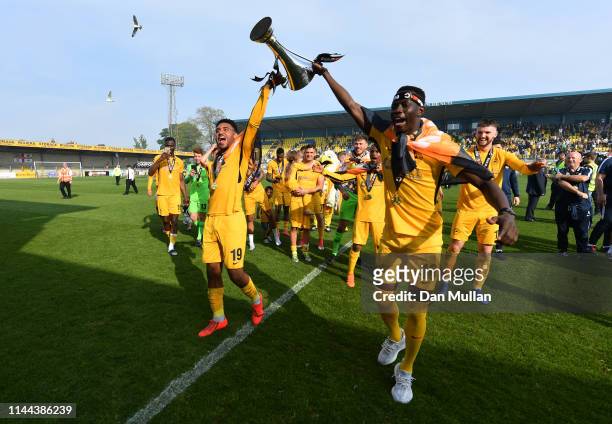 Jamie Reid and Jason Banton of Torquay United celebrate with the Vanarama National League South Trophy as Torquay United are crowned champions...
