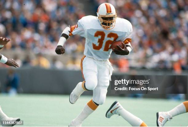 James Wilder of the Tampa Bay Buccaneers carries the ball against the Chicago Bears during an NFL football game circa 1983 at Soldier Field in...