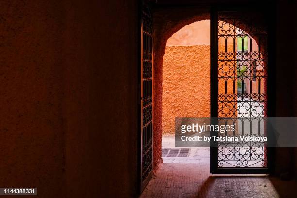 marrakesh medina opened metal gate, morocco, africa - morocco interior ストックフォトと画像